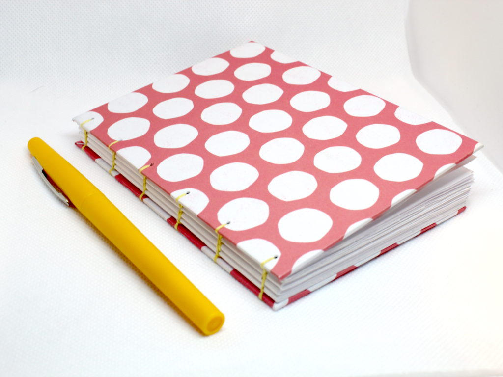 pink and white notebook
